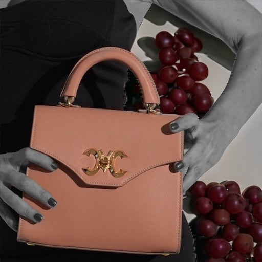 Mariana Malni vegan leather vs real leather bag comparison — luxury handbags Dubai